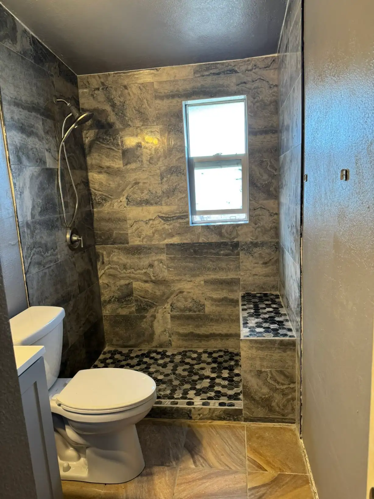 Beautifully remodeled bathroom with modern tile and fixtures